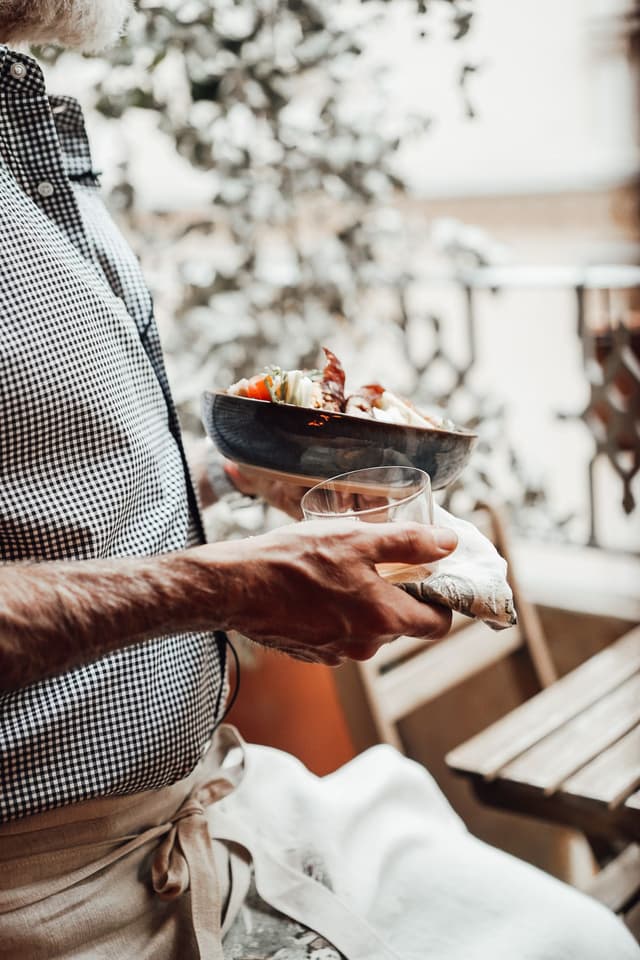 A waiter serving a table
