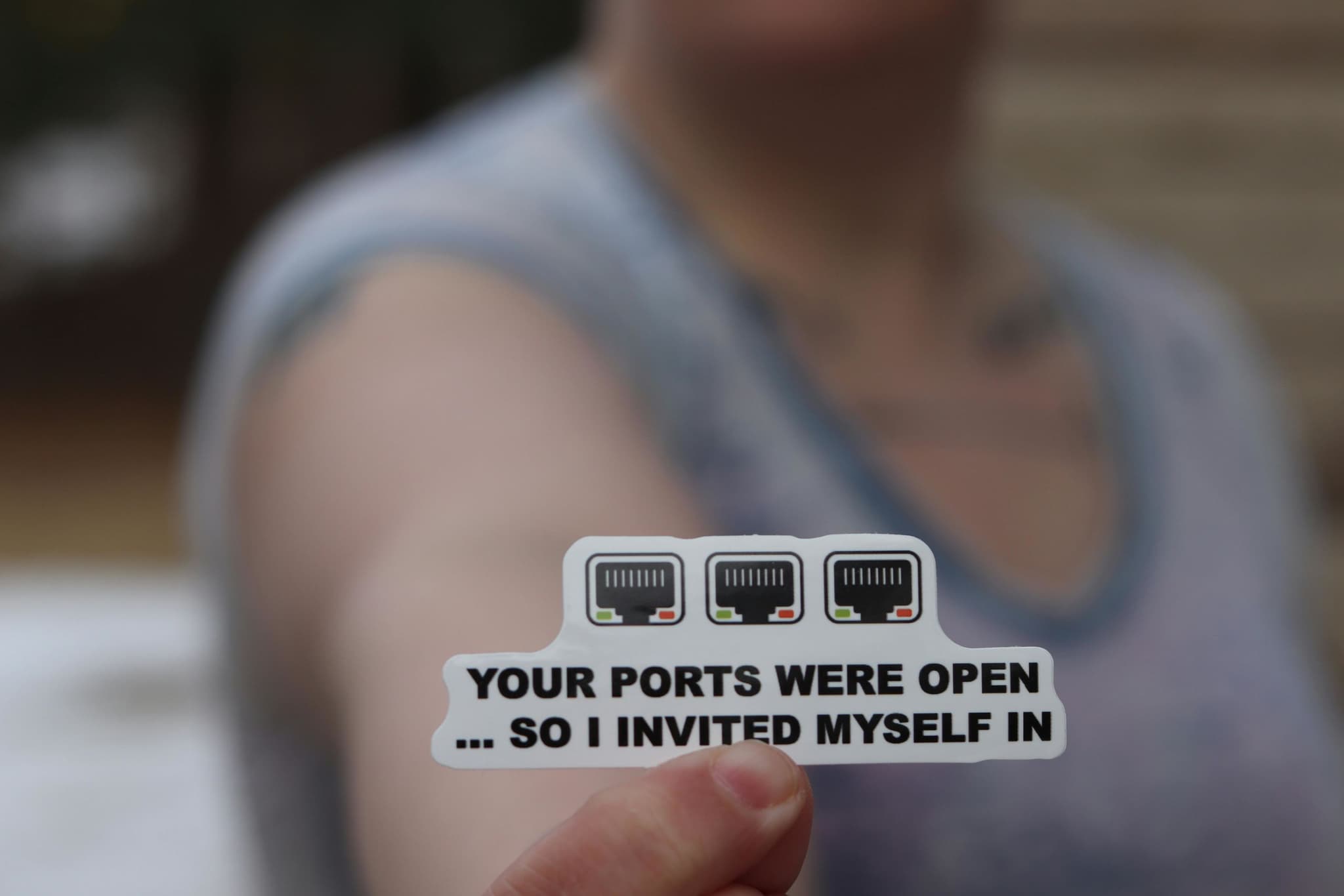 A sticker reading 'Your ports were open... so I invited myself in'