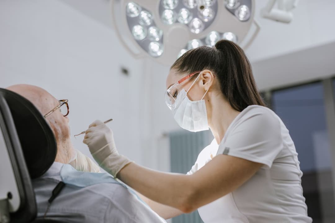 A dentist working on a patient in a modern dental office
