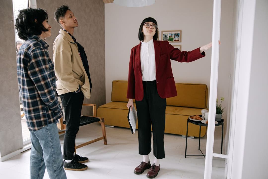 A realtor showing an apartment to buyers